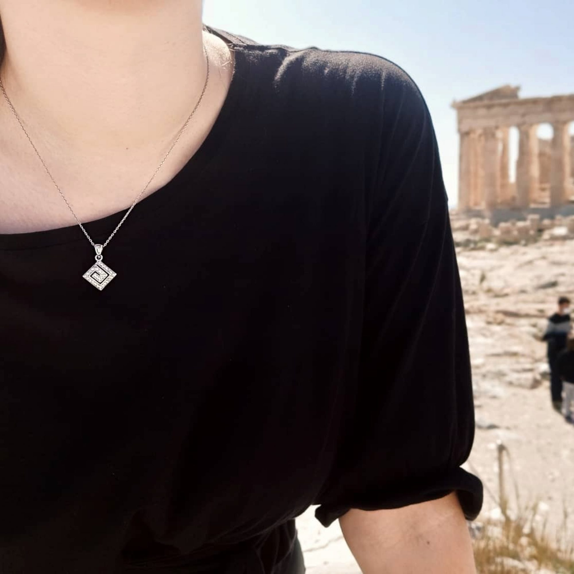 Rhomboid pendant with zircon stones