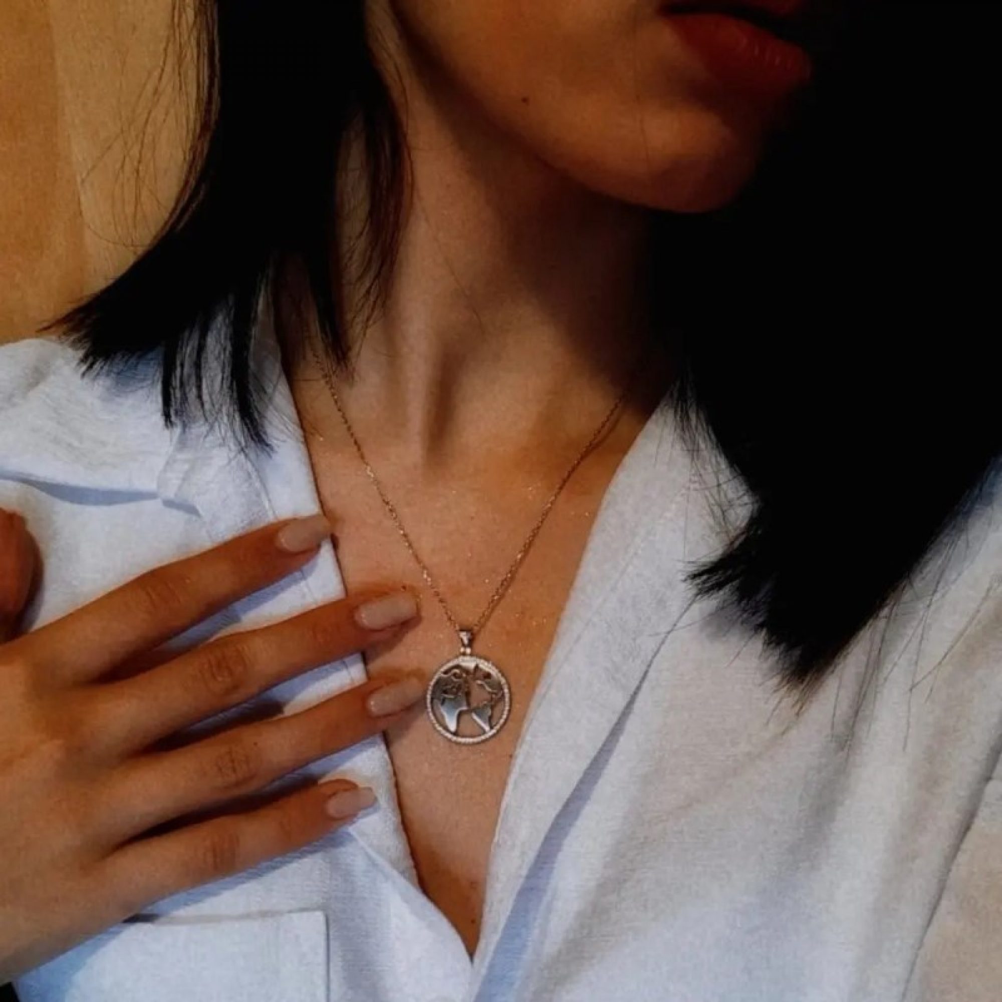 Silver globe necklace with zircon stones