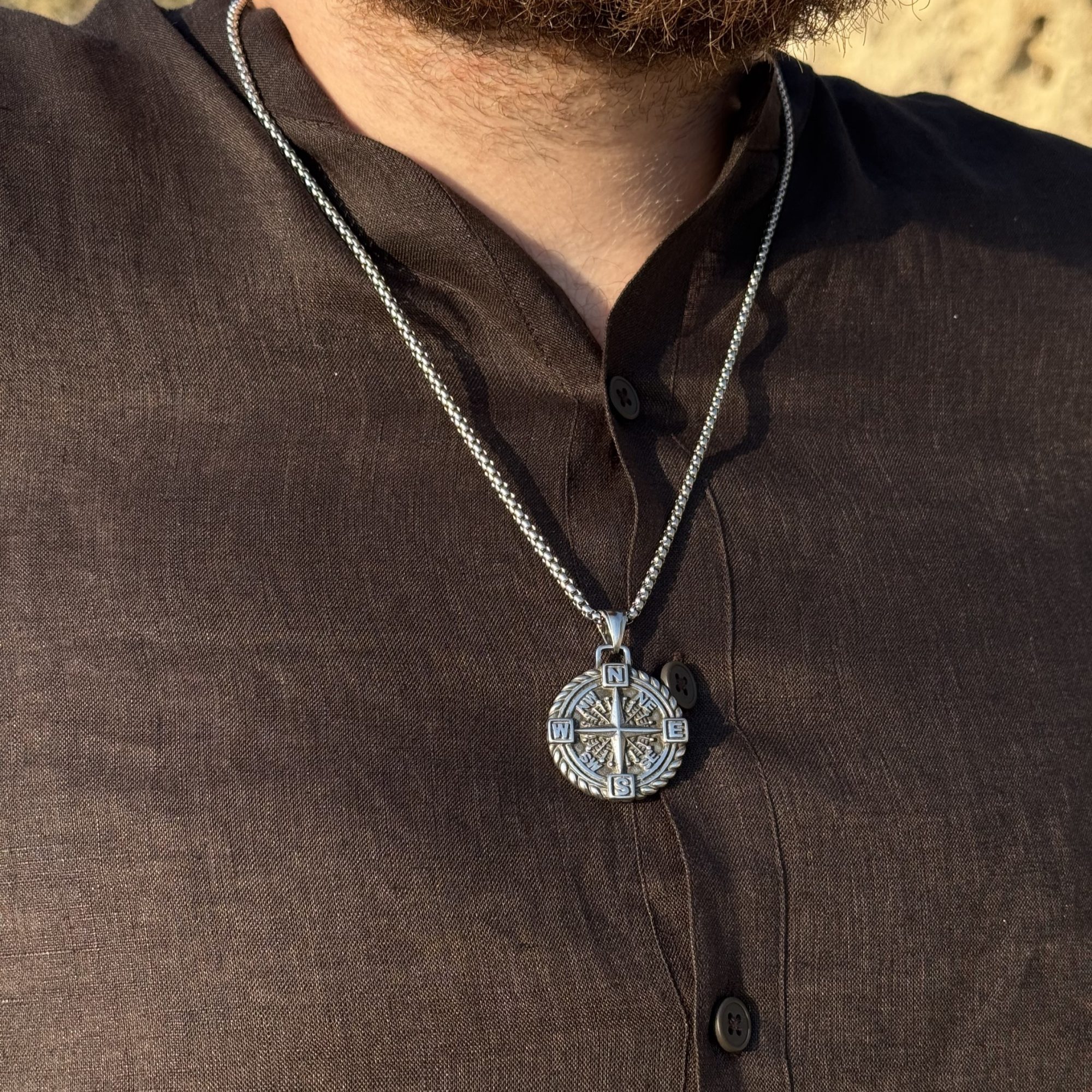 Steel compass necklace