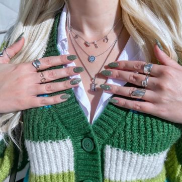 Silver necklace with zircon stones and good luck charms