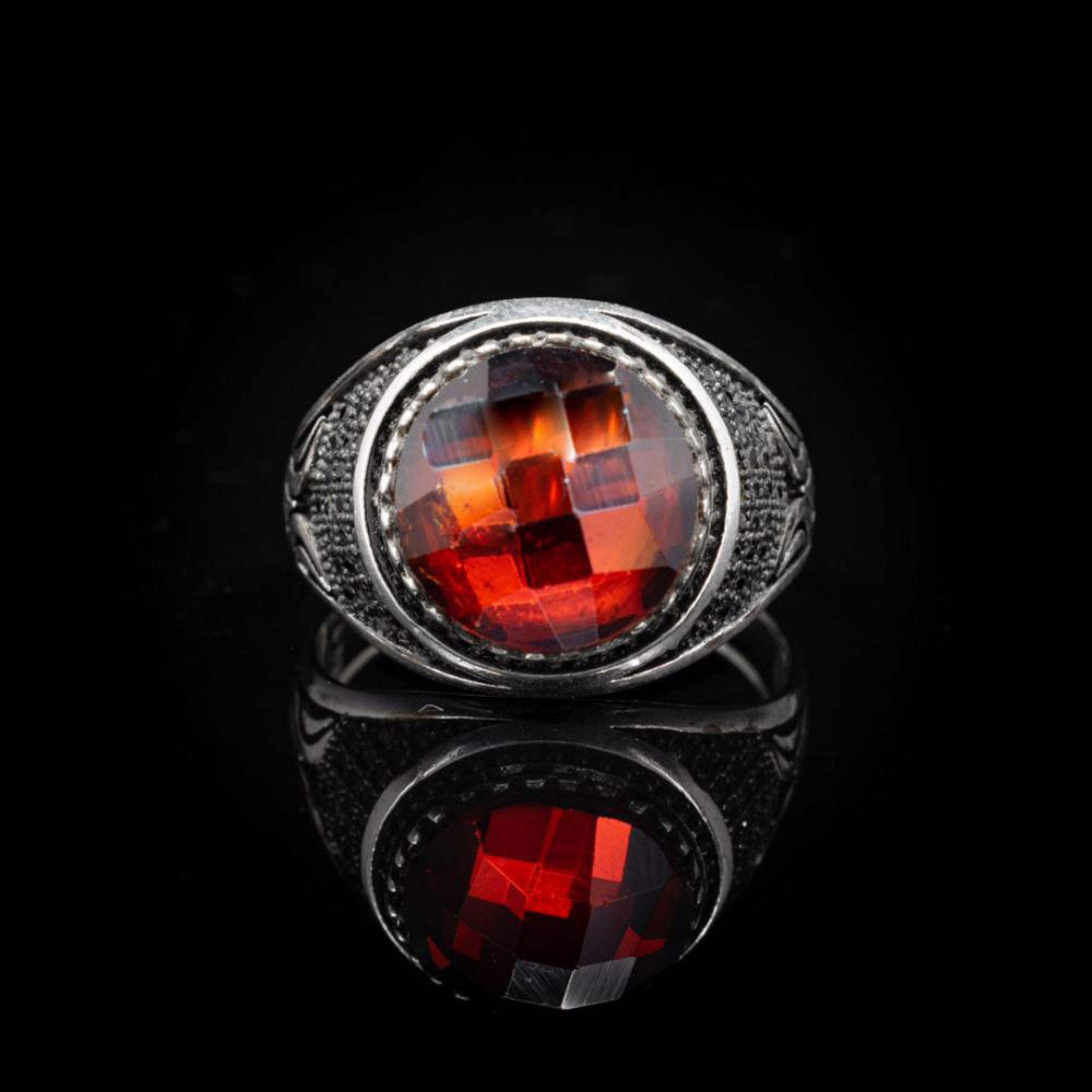 Silver ring with garnet stone