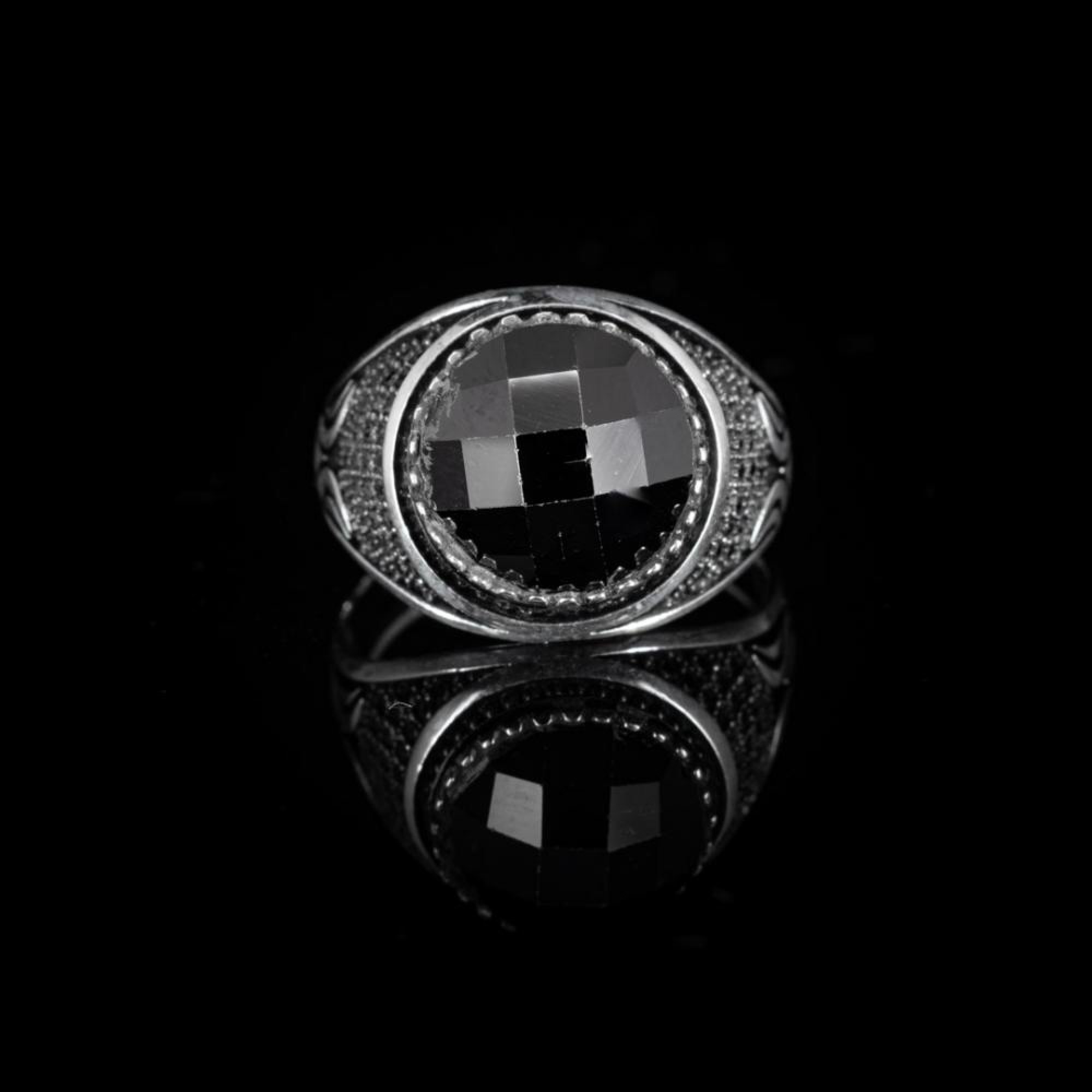 Silver ring with black zircon stone