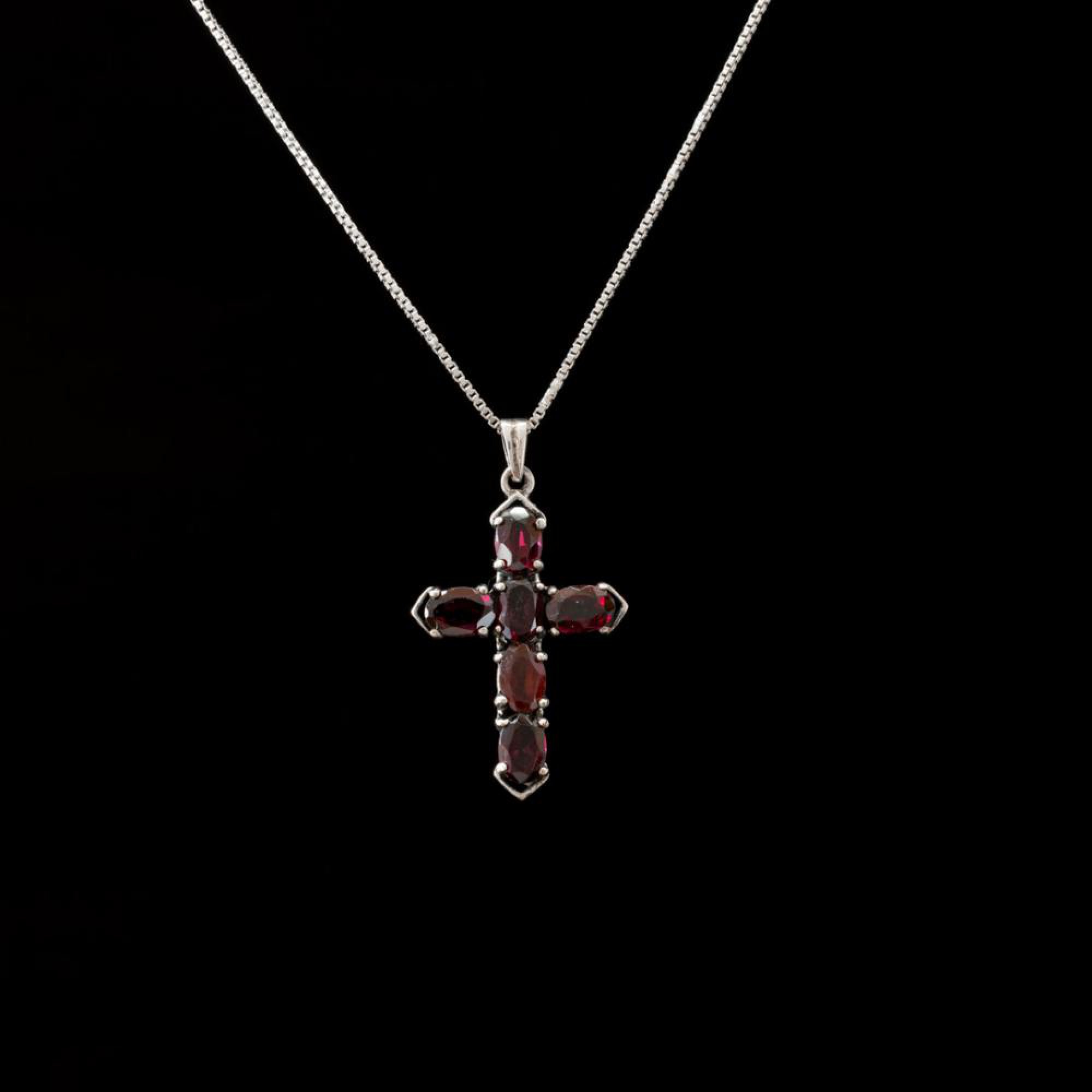 Silver cross with garnet stones